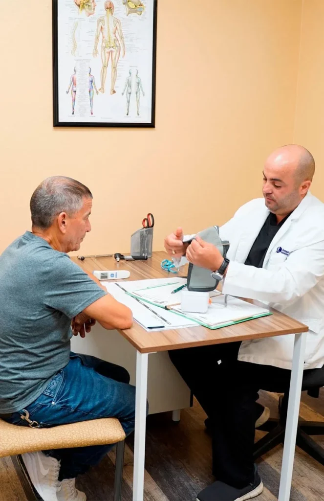 Doctor taking a patient blood pressure reading